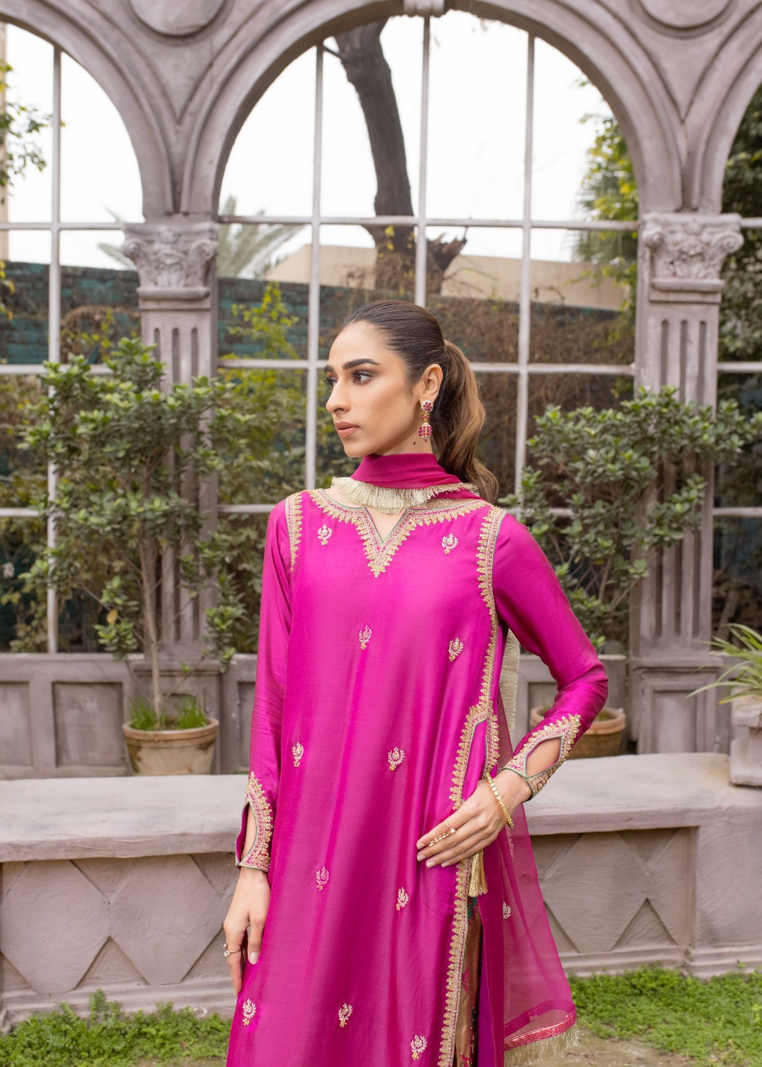 Luxurious Sadia Tariq ensemble: Dark pink silk shirt with intricate bead work, paired with raw silk shalwar & chiffon dopata.
